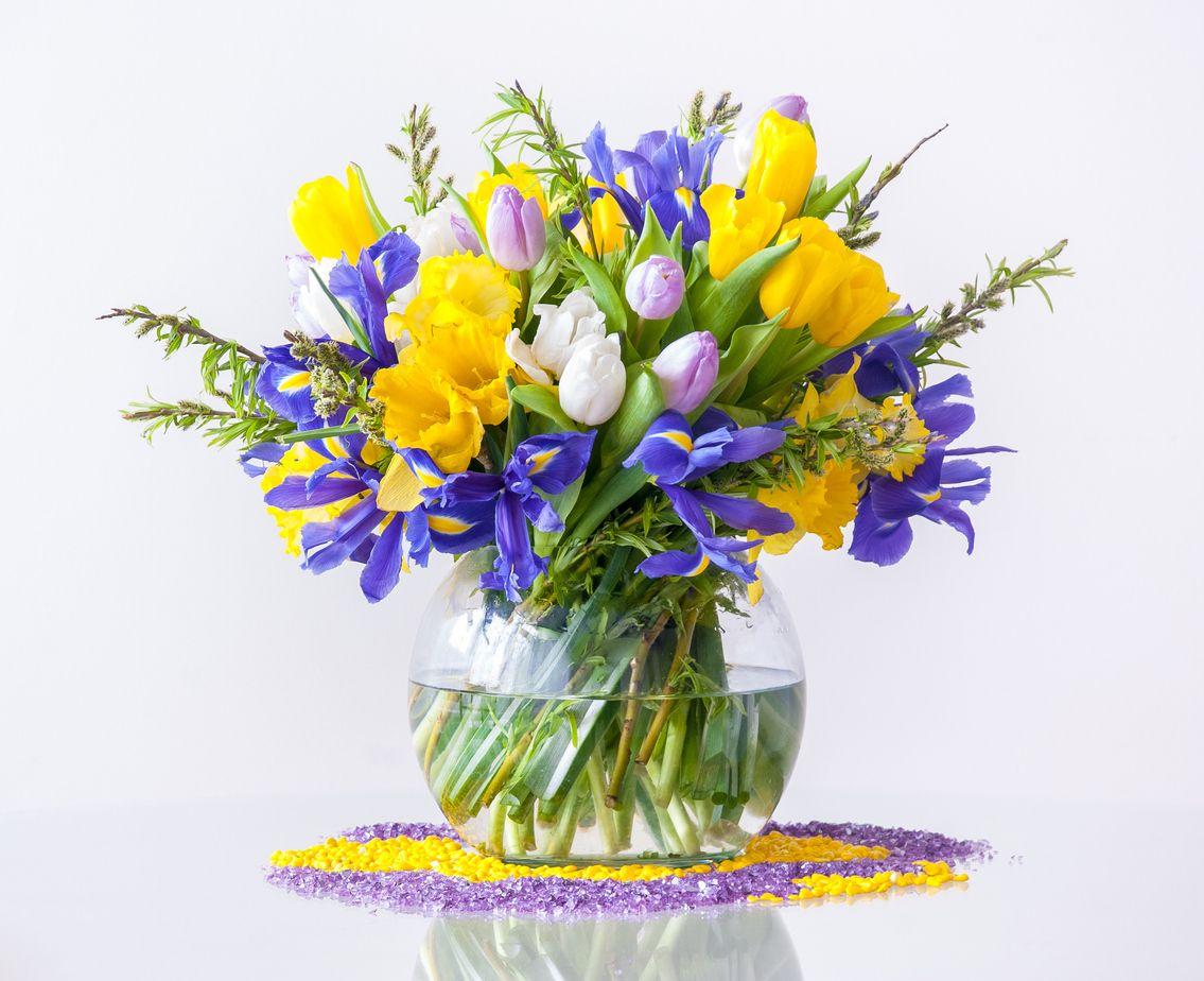 A bouquet featuring daffodils, tulips, and irises