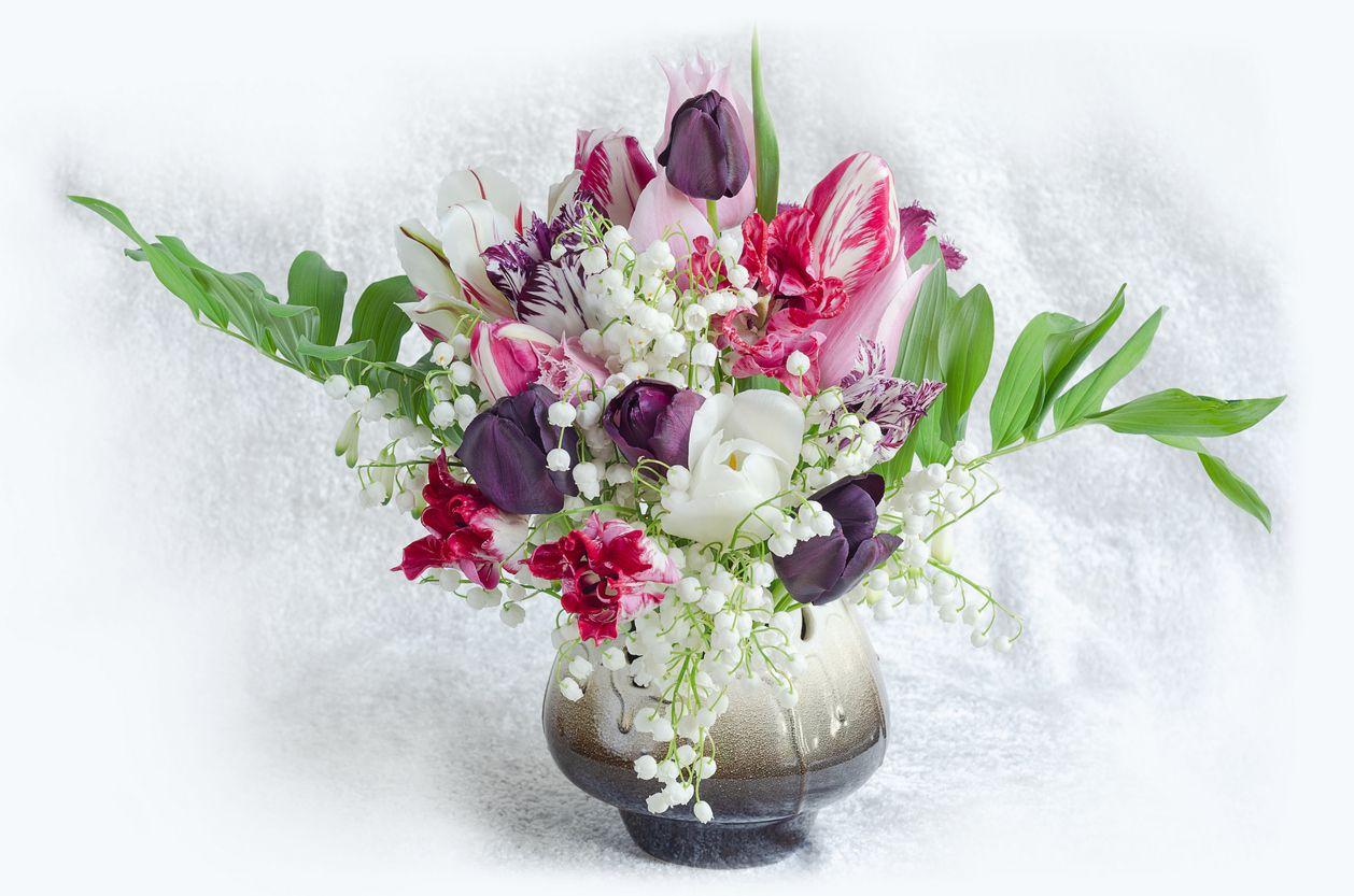 A bouquet featuring tulips and lilies of the valley