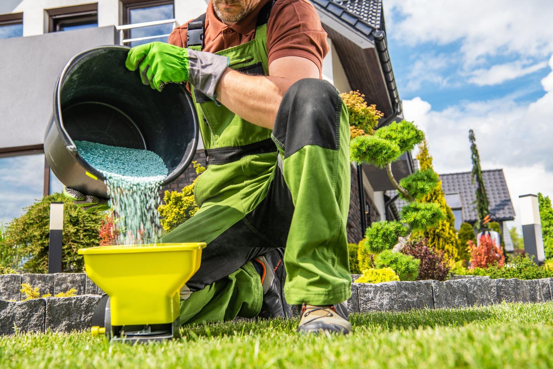 Man preparing grass fertilizer