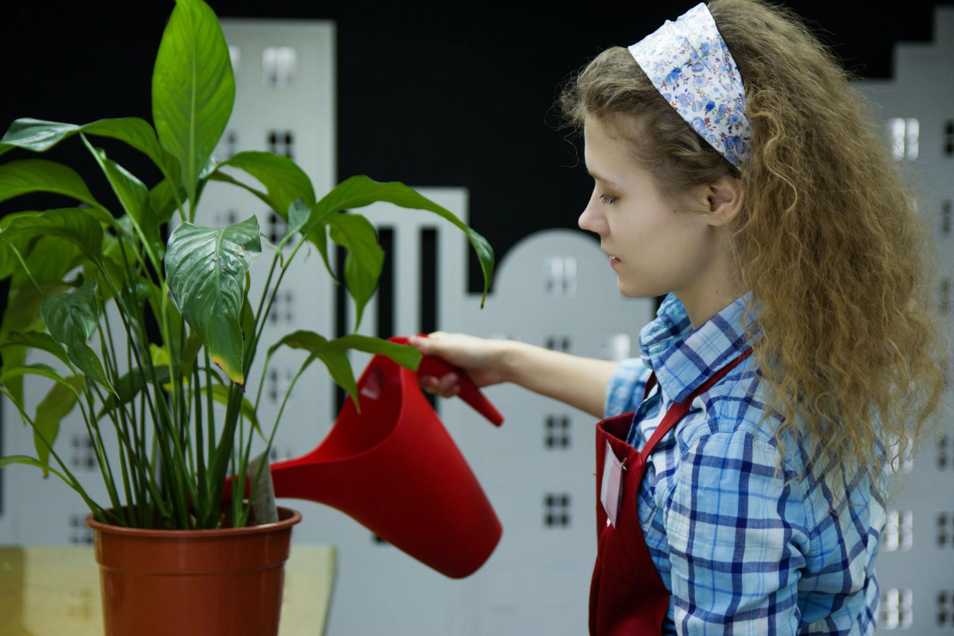 Little Girl Watering Plants