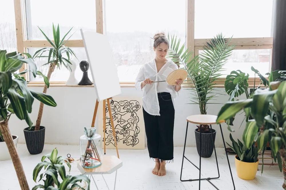 Painter in a Living Room with Houseplants 