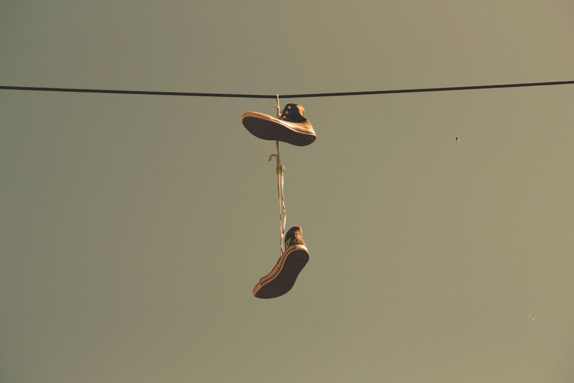 Shoes Hanging on a Thread