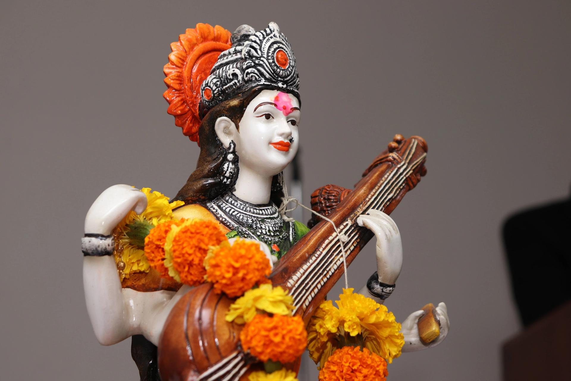A Hindu God Statue with Marigolds
