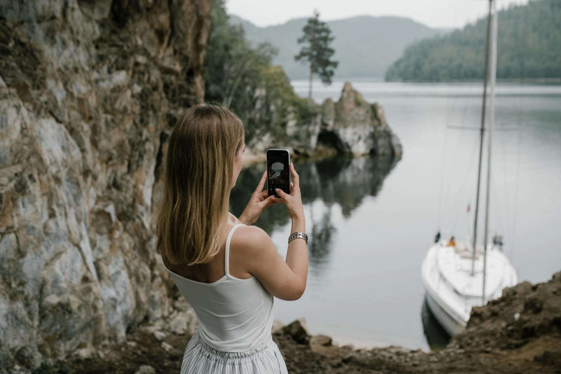 A Woman Taking a Picture During Her Travels